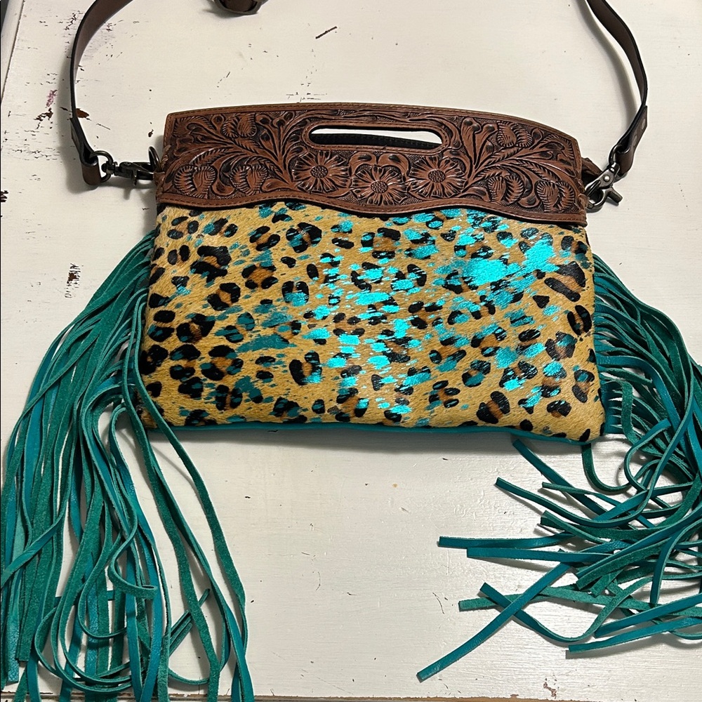 American Darling Tooled Leather Fringe Shoulder bag featuring a hair-on cowhide